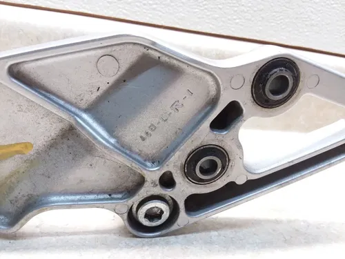 1995 Suzuki GSXR 1100 Left Front Footrest Mount Bracket GSXR1100-W PA AP-304