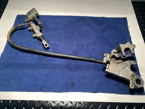 1999 Rm250 OEM Rear Brake Assembly Rear Caliper Master Guard 1999 OEM RM