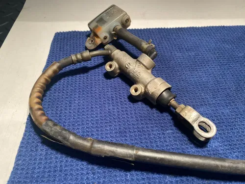 1999 Rm250 OEM Rear Brake Assembly Rear Caliper Master Guard 1999 OEM RM