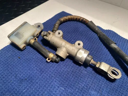 1999 Rm250 OEM Rear Brake Assembly Rear Caliper Master Guard 1999 OEM RM