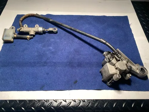 1999 Rm250 OEM Rear Brake Assembly Rear Caliper Master Guard 1999 OEM RM