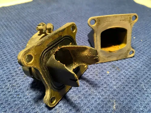2002 KAWASAKI KX85 OEM INTAKE REED BLOCK ASSEMBLY CARBURATOR HOLDER