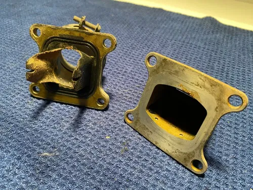 2002 KAWASAKI KX85 OEM INTAKE REED BLOCK ASSEMBLY CARBURATOR HOLDER