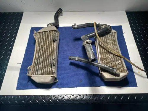 1999-2000 Suzuki RM 250 Radiators Left Right AND HOSE ASSEMBLY OEM SUZUKI