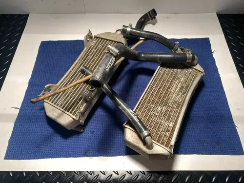 1999-2000 Suzuki RM 250 Radiators Left Right AND HOSE ASSEMBLY OEM SUZUKI