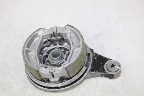 1984 Kawasaki KX125 OEM Rear brake backing plate with shoes KX 125 84/4