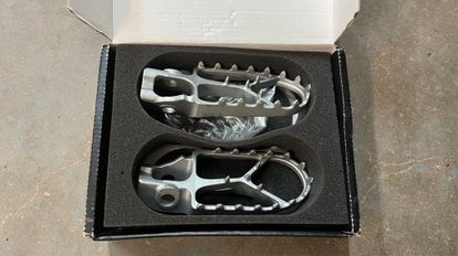 Stock KTM Footpegs With Springs.