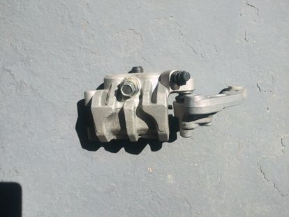 Nissan Front Brake Caliper w/ Mount