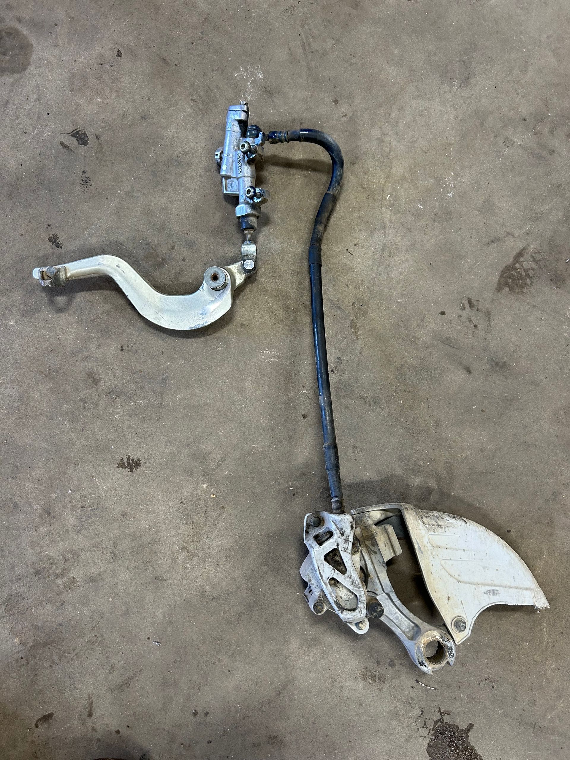 Rear break assembly for a 2003 yamaha yz125