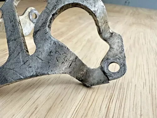 1990 Honda CR250R OEM Rear Brake Caliper Guard Protector - Needs Repair