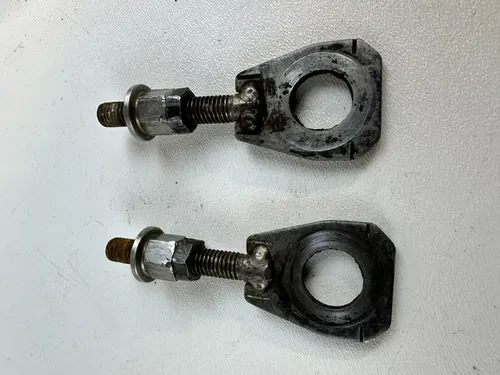 2006 HONDA CR85R OEM Chain Axle Tensioners Set 03-07