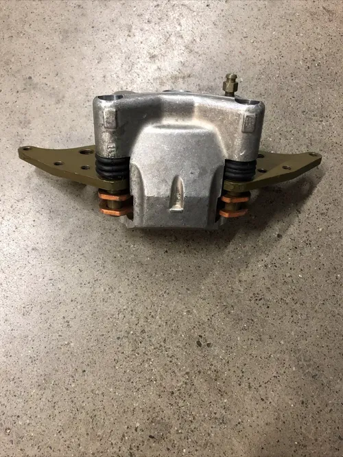 OEM POLARIS RZR 900 1000 LEFT LH FRONT BRAKE CALIPER BRACKET PADS 1912244 15-21