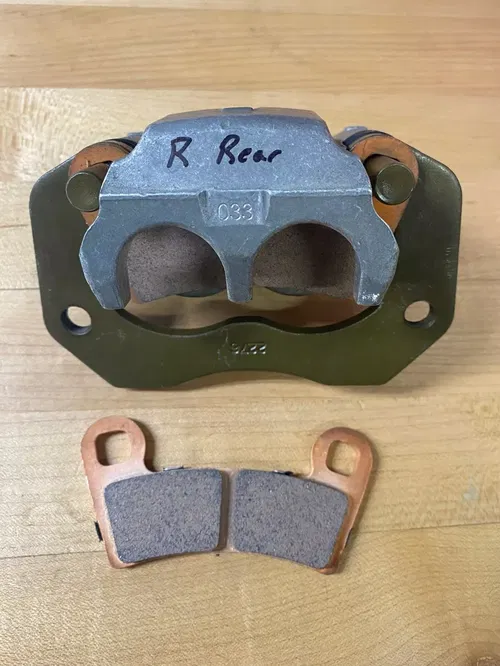 OEM POLARIS RZR 900 1000 RIGHT RH REAR BRAKE CALIPER BRACKET PADS 1912275 15-21