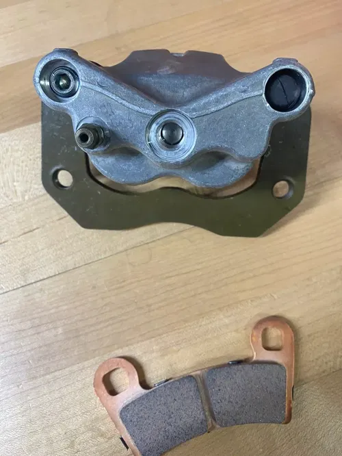 OEM POLARIS RZR 900 1000 RIGHT RH REAR BRAKE CALIPER BRACKET PADS 1912275 15-21
