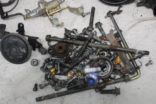 03-05 YAMAHA YZF R6 PARTS HARDWARE BOLTS KICKSTAND SPROCKET AXLE PEGS HORN