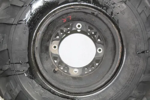 02 POLARIS SPORTSMAN 400 LEFT REAR WHEEL RIM (SEE DESCP)