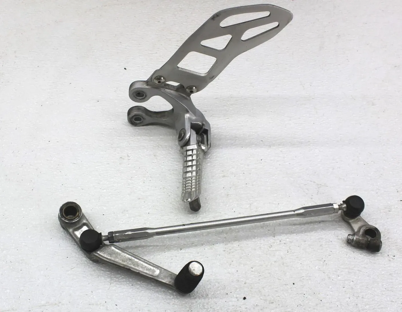 09-11 SUZUKI GSXR1000 FRONT DRIVER LEFT FOOT PEG REARSET SHIFTER