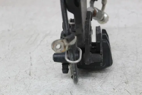 06 TRIUMPH SPEEDMASTER REAR BACK BRAKE CALIPER W MOUNT BRACKET