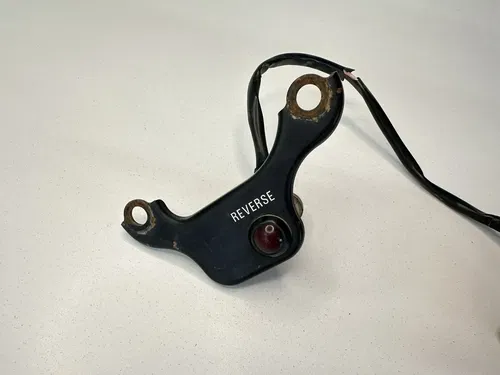USED OEM 90-04 KAWASAKI 250 MOJAVE REVERSE LIGHT & MOUNTING BRACKET ASSY