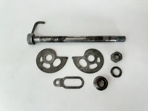 OEM 1985 85 HONDA XR250R XR 250 R REAR WHEEL AXLE W SPACER & CHAIN ADJUSTERS