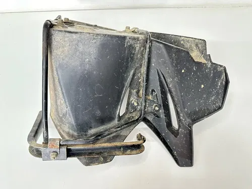 USED OEM 07 08 OUTLAW 525 S IRS LEFT SIDE HEEL GUARD & PEG W SUPPORT BRACKETS