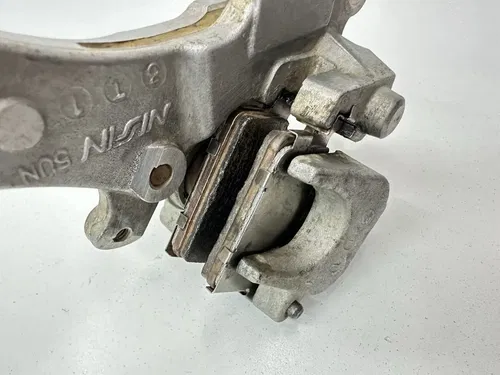 USED OEM 04 2004 YAMAHA YZ 125 YZ450F WR250F WR450F REAR BRAKE CALIPER & MOUNT