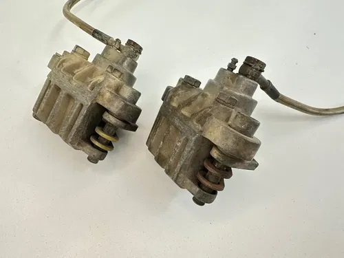 USED OEM 03 04 POLARIS 500 PREDATOR FRONT BRAKE CALIPERS CALIPER SET W LINES