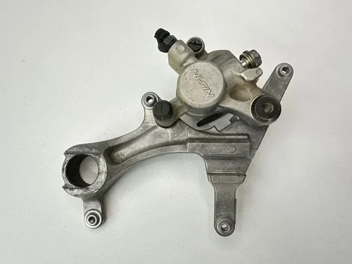 USED OEM 2004 04 2005 05 KAWASAKI KX250F REAR BRAKE CALIPER & MOUNT ASSY