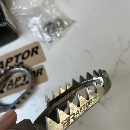 Raptor Titanium Edge Custom Kawasaki lowered foot pegs 10mm down 5mm back