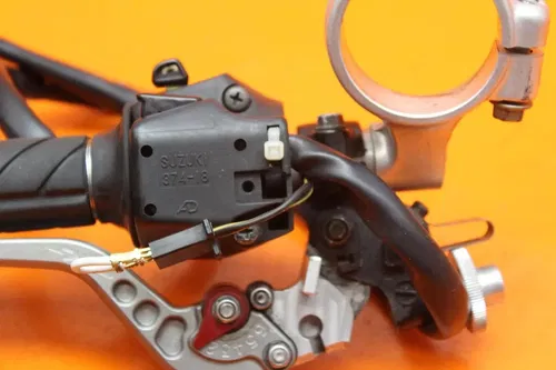 2001 2002 SUZUKI GSXR 1000 OEM LEFT CLIP ON HANDLEBAR W SWITCHES AND CRG LEVER