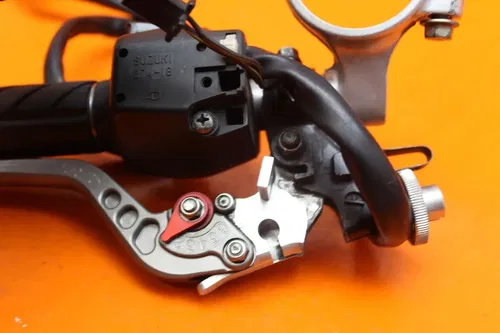 2001 2002 SUZUKI GSXR 1000 OEM LEFT CLIP ON HANDLEBAR W SWITCHES AND CRG LEVER