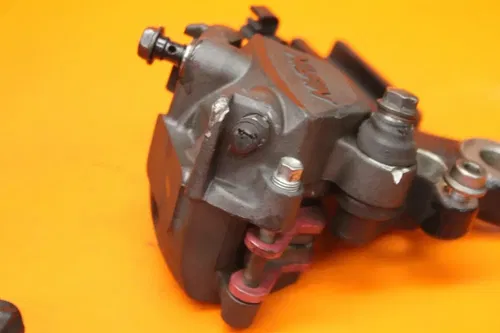 17-25 2017 KAWASAKI NINJA 650 OEM REAR BRAKE CALIPER W MOUNT BRACKET W PADS