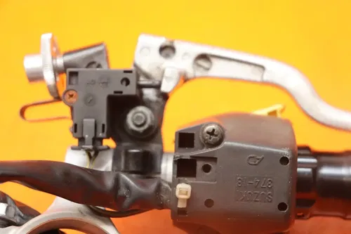 03-04 SUZUKI GSXR 1000 OEM LEFT CLIP ON HANDLEBAR W SWITCHES