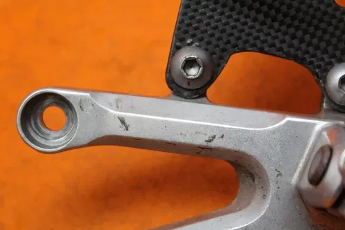 04-07 HONDA CBR1000RR CARBON FIBER LEFT REARSET REAR SET DRIVER FOOT PEG REST