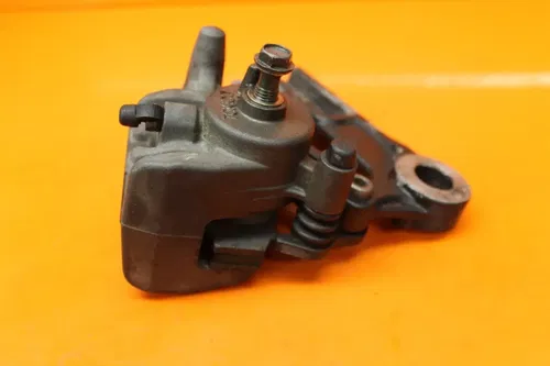 06-10 KAWASAKI NINJA ZX10R OEM REAR BACK BRAKE CALIPER W MOUNT BRACKET