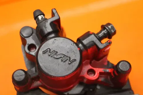 2019 HONDA GROM 125 OEM REAR BACK BRAKE CALIPER W MOUNT BRACKET WITH PADS