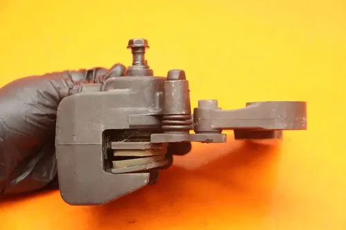 09-10 KAWASAKI ER-6N OEM REAR BACK BRAKE CALIPER W MOUNT BRACKET