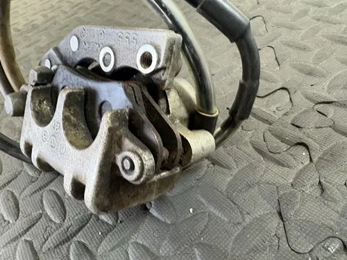 2007 07-10 RMZ250 OEM Front Brake System Caliper Holder Bracket Pads Line