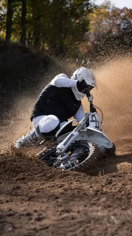 Rider cornering a dirt bike