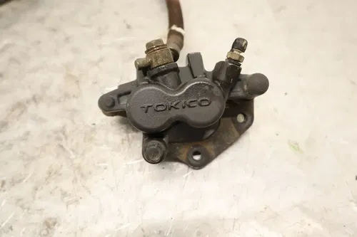 2002 Kawasaki Prairie 650 KVF650A 4x4 OEM LEFT FRONT BRAKE CALIPER