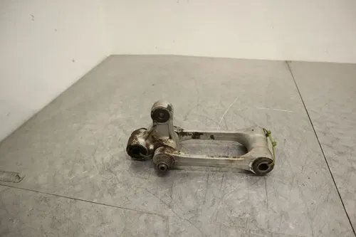 2004 2005 KAWASAKI KX250F OEM REAR DOGBONE SHOCK LINKAGE LINK 39007-0001