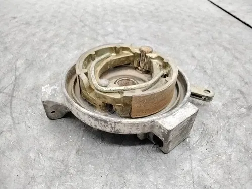 2006 POLARIS PREDATOR 90 OEM LEFT FRONT BRAKE DRUM PLATE ASSEMBLY