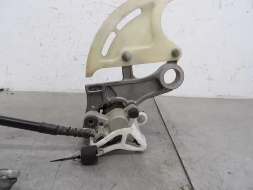 2006 HONDA CRF250X REAR BACK BRAKE CALIPER ASSY.