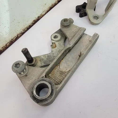 2002-2018 YAMAHA YZ85 Rear Caliper Mounting Bracket And Caliper Guard OEM
