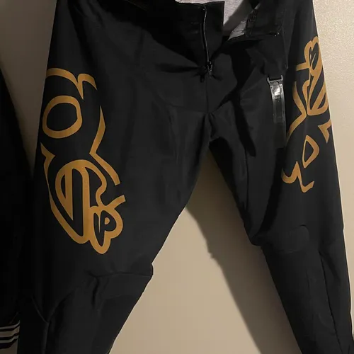 ogs mx gold and black pants