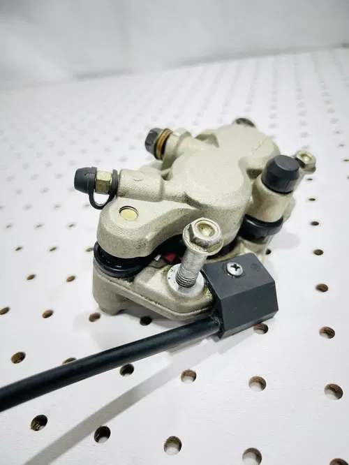 Honda CRF450X - Stock Front Brake Caliper w/ Pads Nissin - 2005 CRF 450 OEM