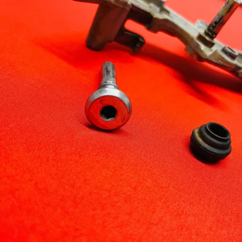 CRF450R Rear Brake Caliper Mount Bracket GENUINE OEM HONDA CRF 450 R (05-08)