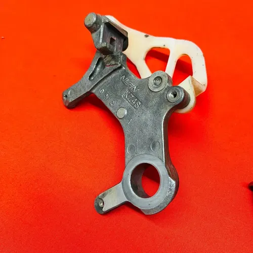 CR125 Rear Caliper Mount Bracket Hanger Genuine OEM HONDA CR 125 R 2000 2001