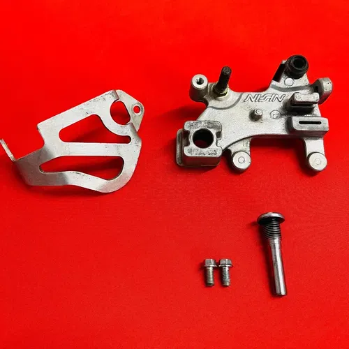 CR85 REAR BRAKE CALIPER MOUNT BRACKET GENUINE OEM HONDA CR 85 R RB (2003-2008)