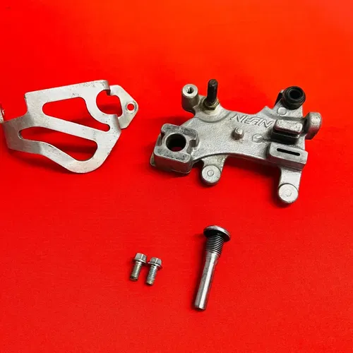 CR85 REAR BRAKE CALIPER MOUNT BRACKET GENUINE OEM HONDA CR 85 R RB (2003-2008)